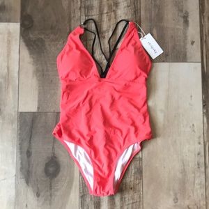 One piece coral swimsuit V neck detail